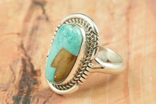 Genuine Crow Springs Turquoise set in Sterling Silver Ring. The Crow Springs Mine is located near Tonopah, Nevada. Created by Navajo Artist Larson Lee. Signed by the artist.